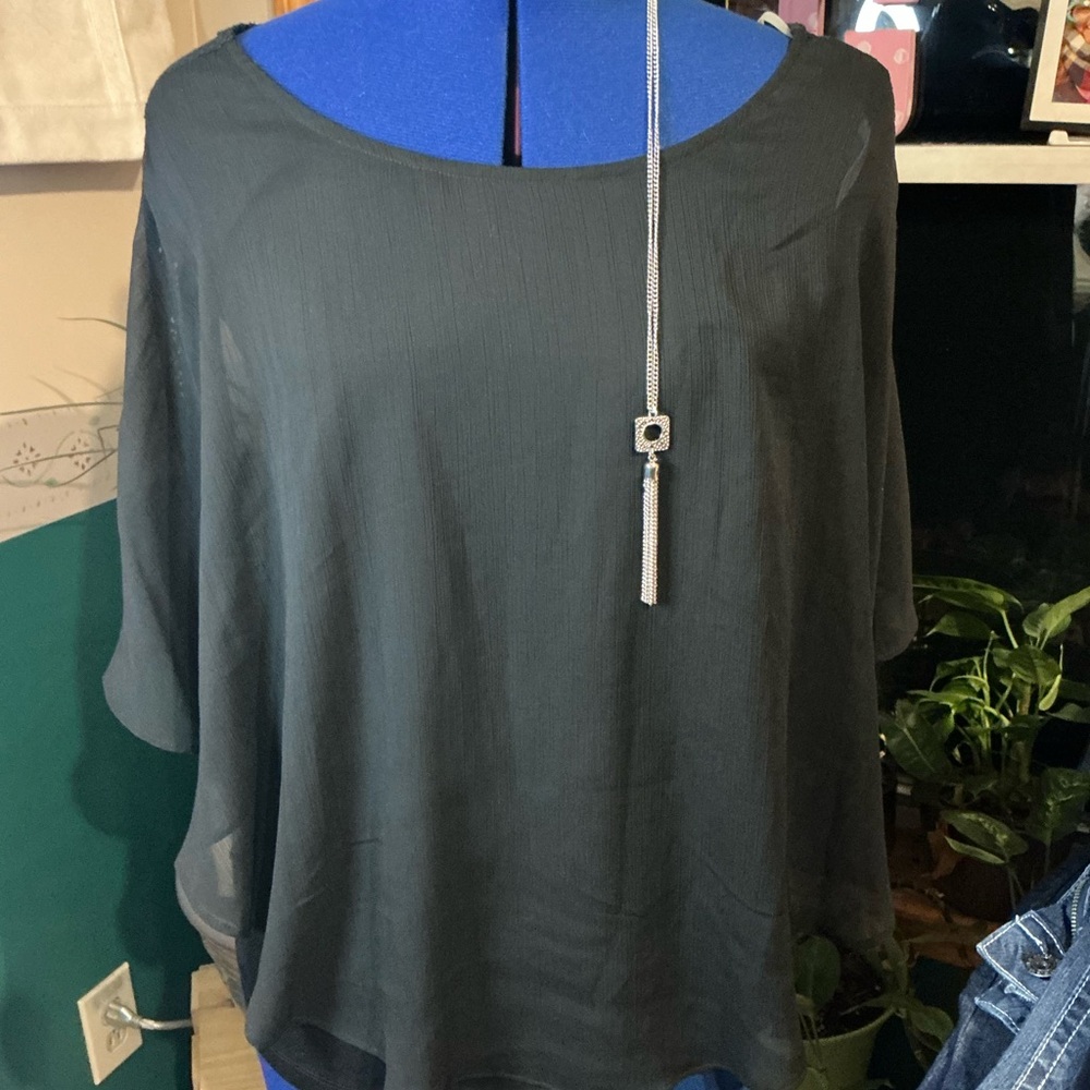 Alyx Elegant Black Sheer Blouse with silver necklace